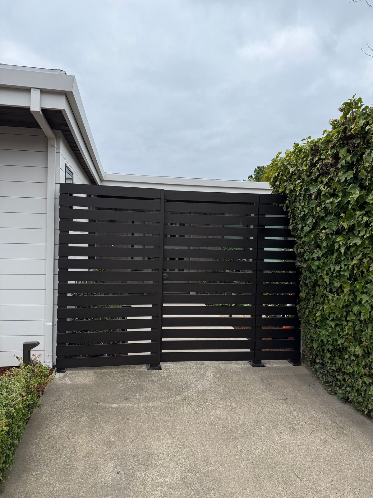Custom horizontal-slat iron driveway gate in Napa, CA
