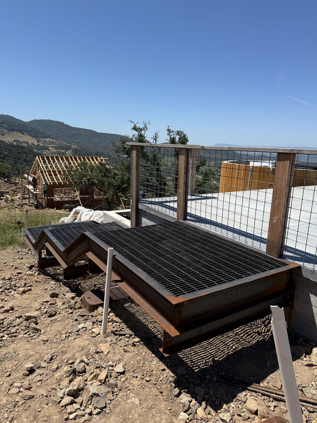 Custom iron fence and railing sections fabricated in the Robledo Ironworks shop